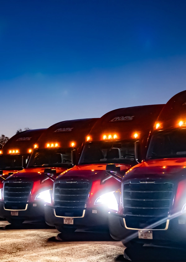 Four semi-trucks at night